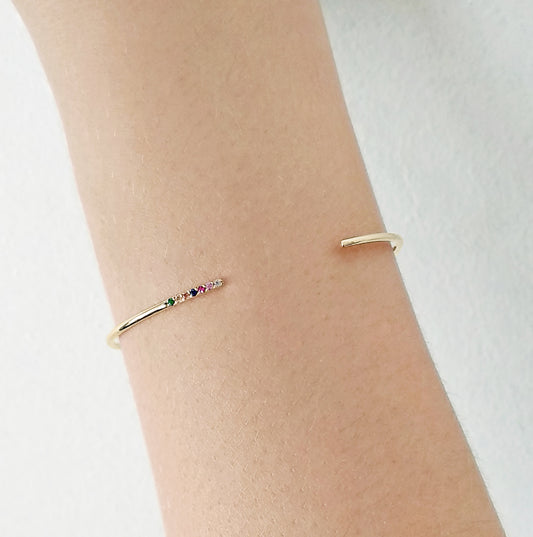 female wrist solid yellow gold rainbow sapphire thin open cuff bracelet