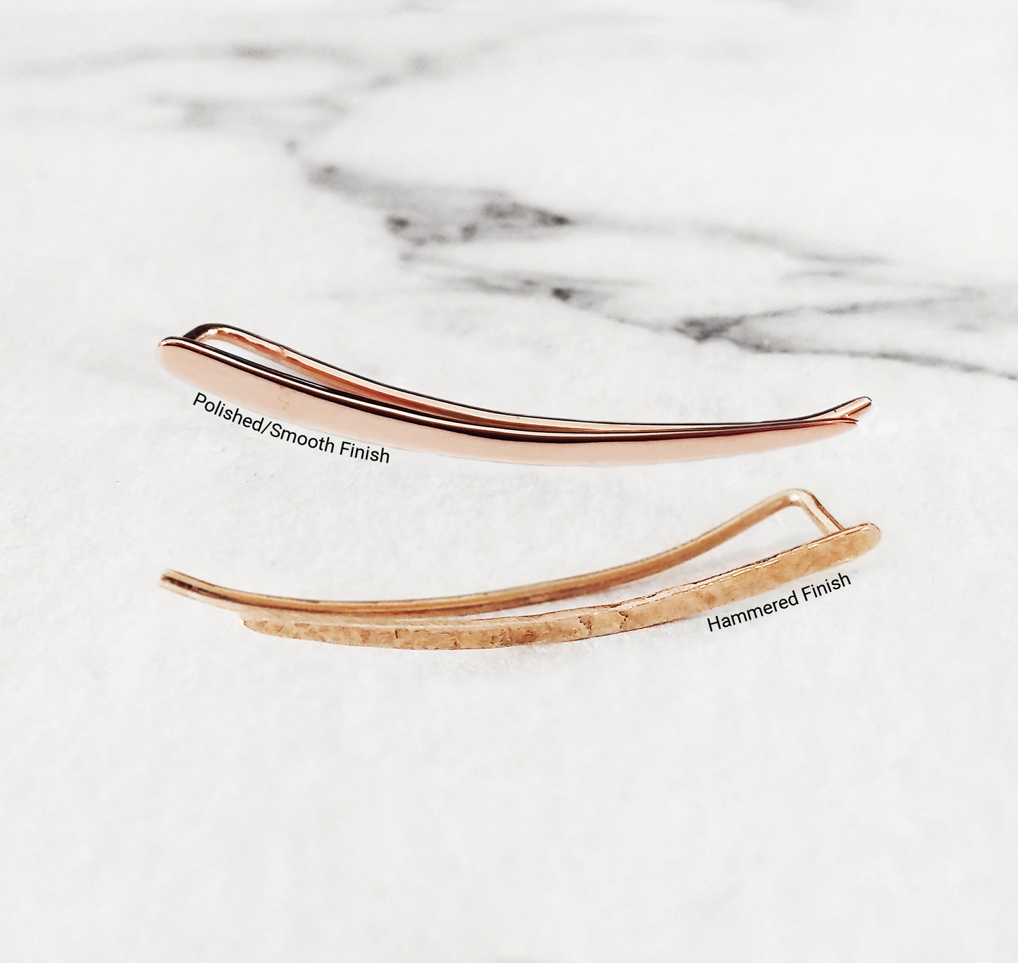 close up of two solid rose gold climber earrings one with a polished smooth finish and the other with a polished finish