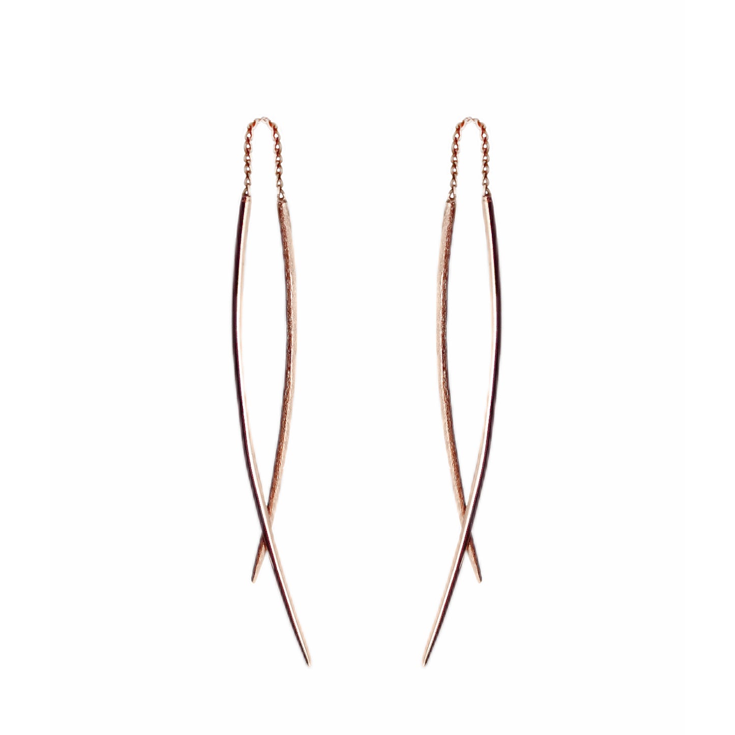 a pair of solid rose gold swing threader earrings with one matte curved bar and one longer polished curved bar