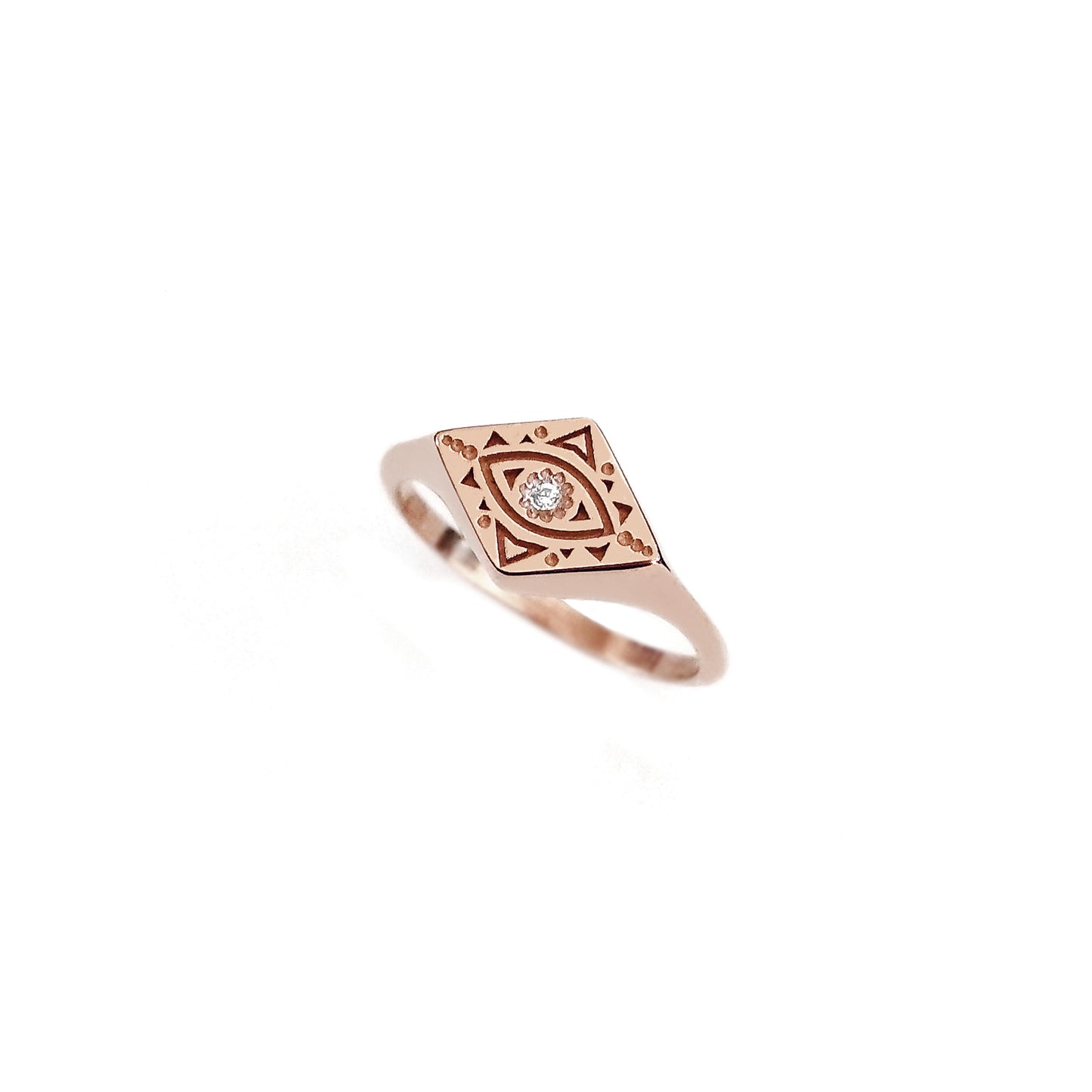 solid rose gold rhombus signet ring engraved with a geometric evil eye and set with a tiny white diamond in the center