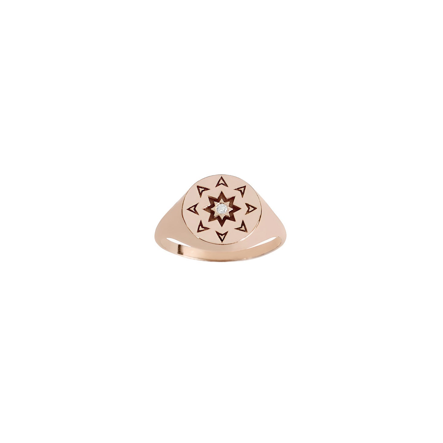 front view of a solid rose gold round signet ring with a north star starburst design and a diamond on the center