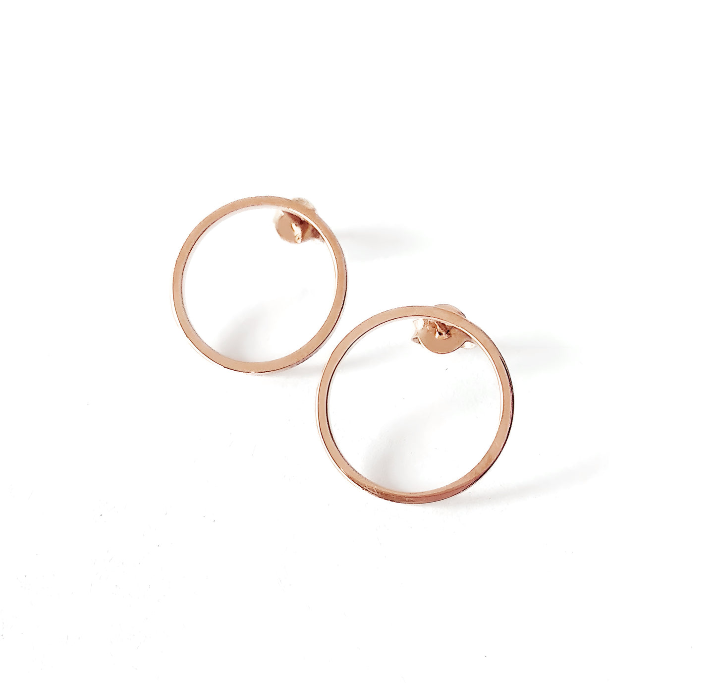 a pair of small open circle hoop stud earrings in solid rose gold