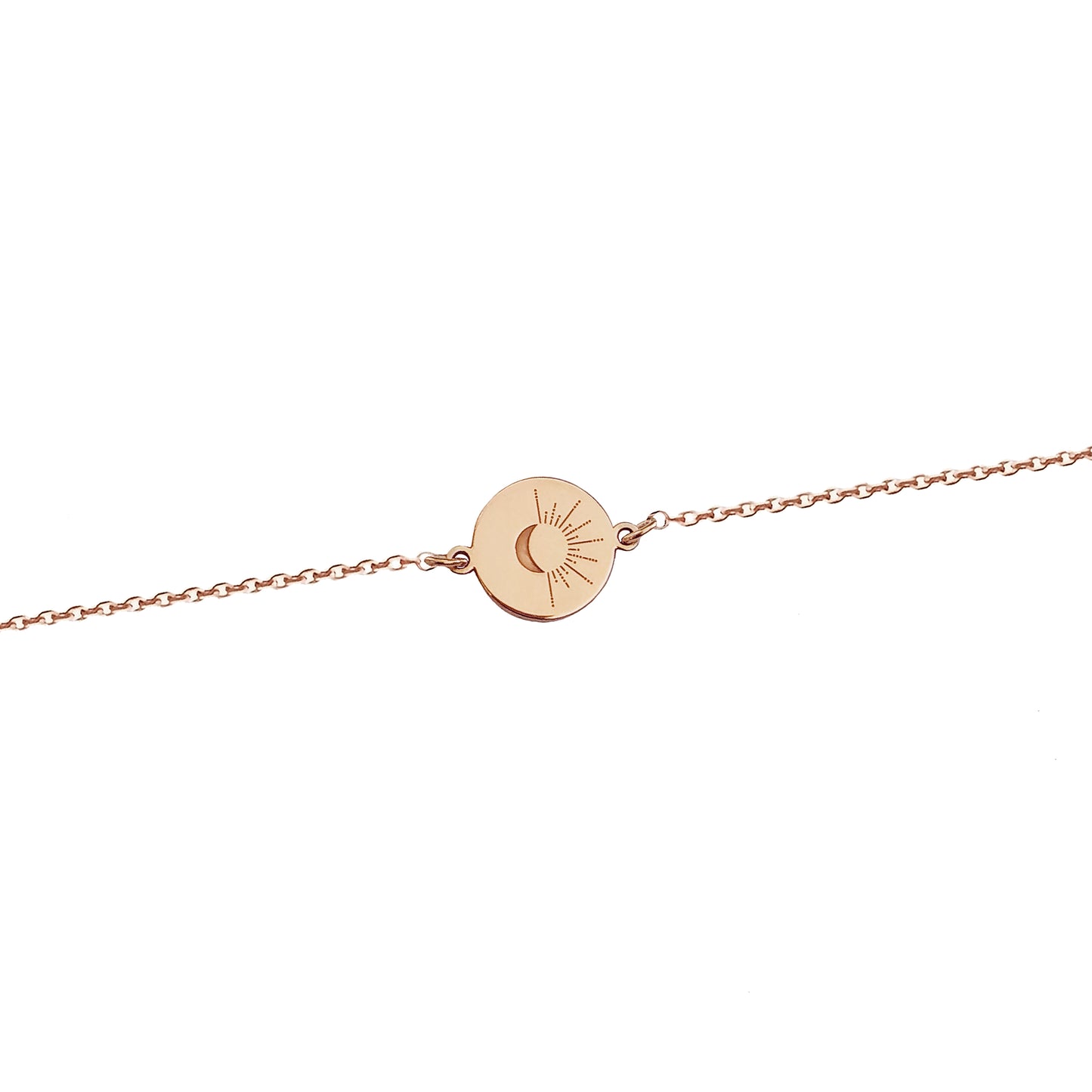 solid rose gold disc charm bracelet engraved with a crescent moon and sun rays