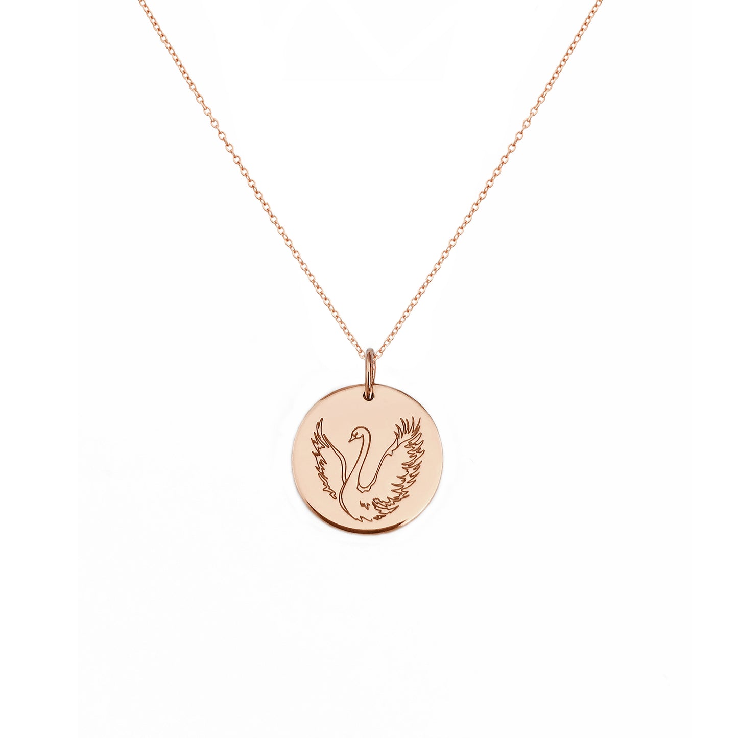 solid rose gold necklace with a 14mm disc pendant engraved with a swan with open wings