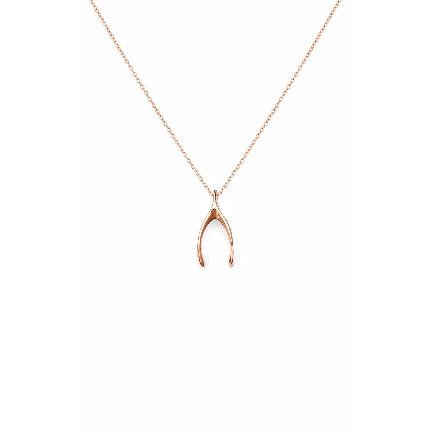 solid rose gold necklace with a tiny wishbone charm