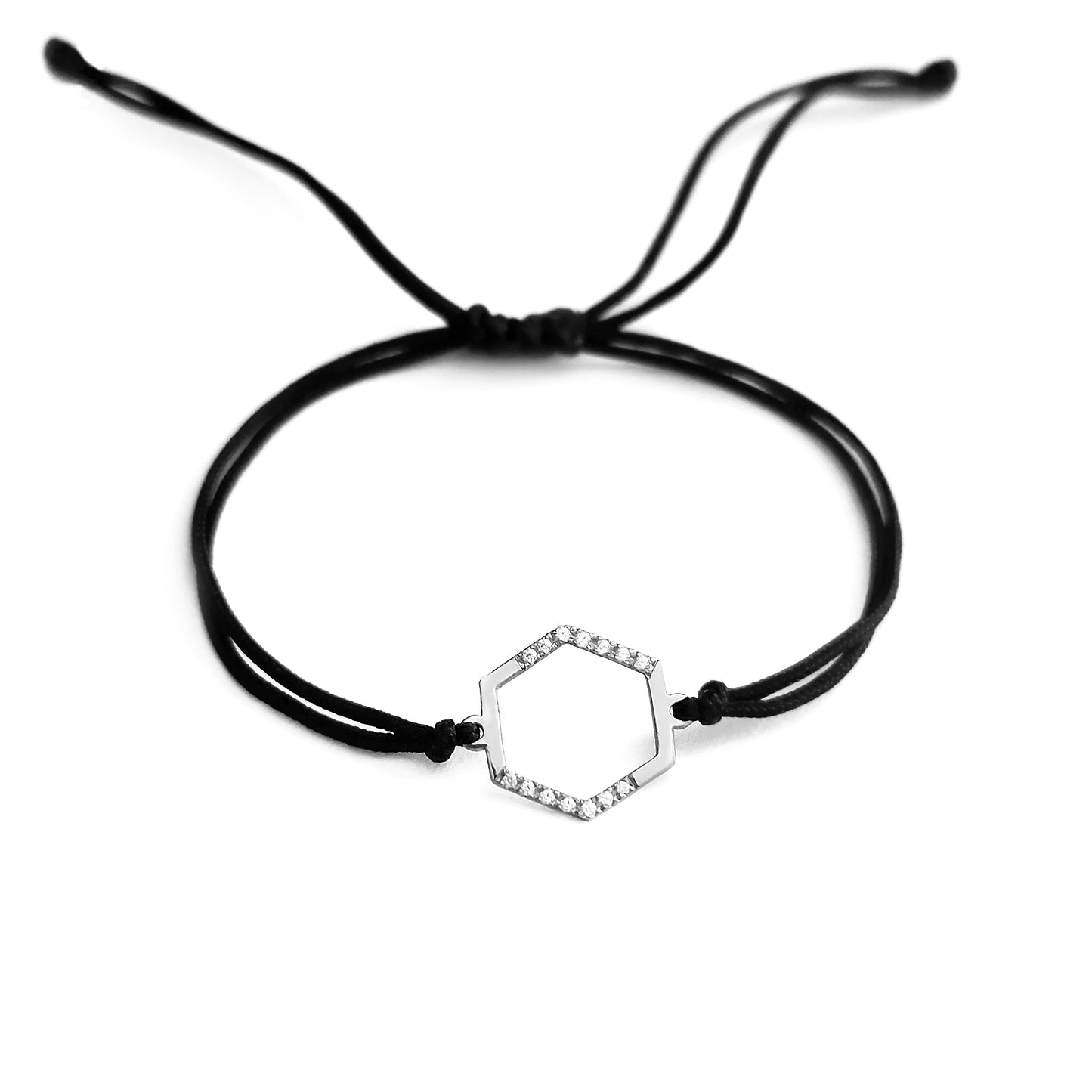 solid white gold macrame bracelet with a small hexagon charm set with 12 white diamonds