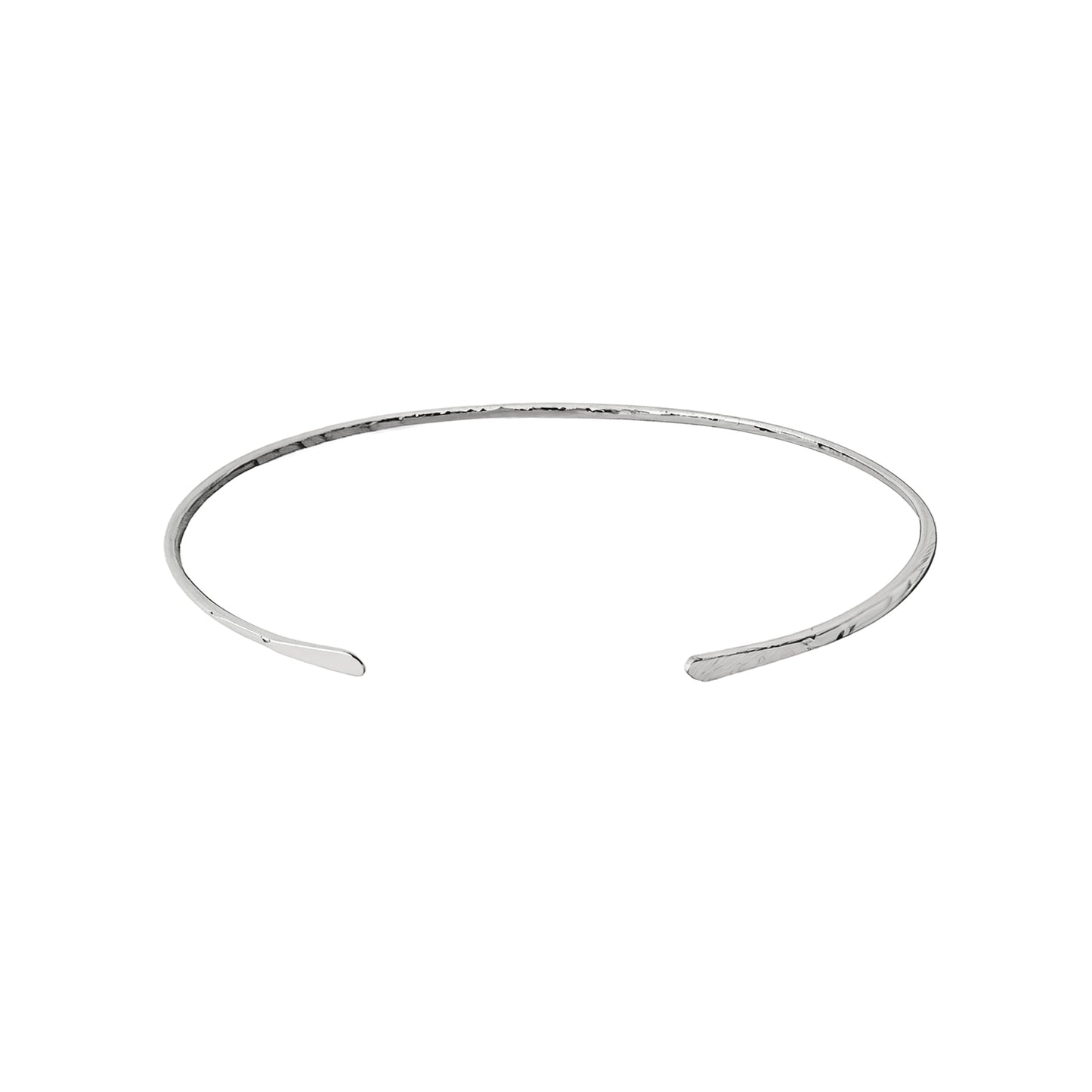 White gold open bangle with hammered finish on a white background