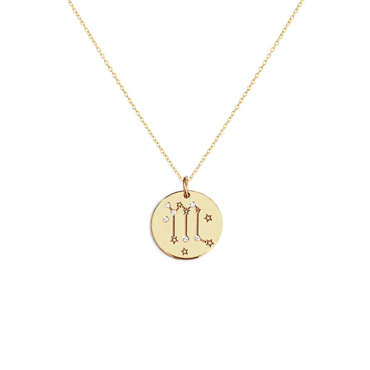 solid yellow gold necklace with a 14mm disc pendant engraved with a zodiac sign and set with six tiny diamonds