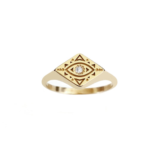 a solid yellow gold rhombus signet ring engraved with a geometric evil eye and set with a tiny white diamond in the center
