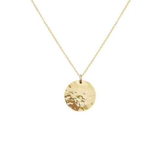 Solid yellow gold necklace with a round hammered pendant on a white background