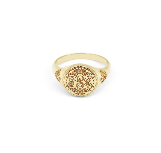 solid yellow gold round signet ring with art nouveau floral designs and engraved with three intertwined initials