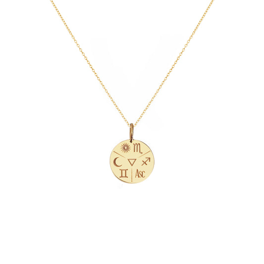 solid yellow gold disc pendant necklace personalized with natal chart zodiac signs of the sun the moon and ascendant and an alchemy element in the center