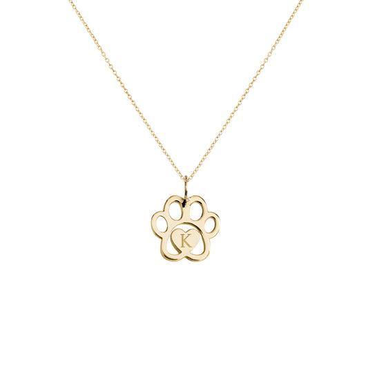 solid yellow gold necklace with a dog paw print pendant engraved with a monogram