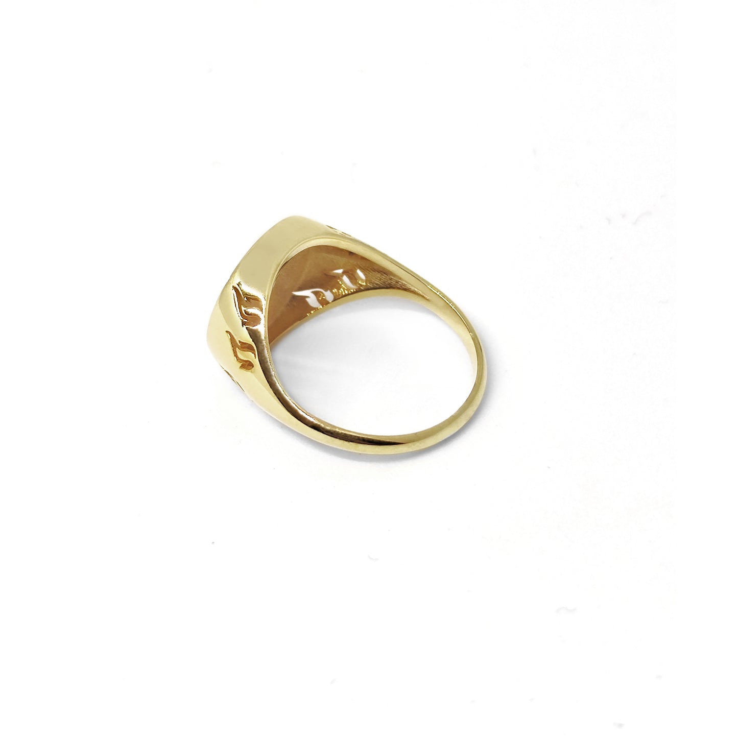 side back view of a gold round signet ring engraved with a phoenix firebird rising with flame cutouts around the base of the ring's head