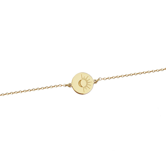 solid yellow gold disc charm bracelet engraved with a crescent moon and sun rays