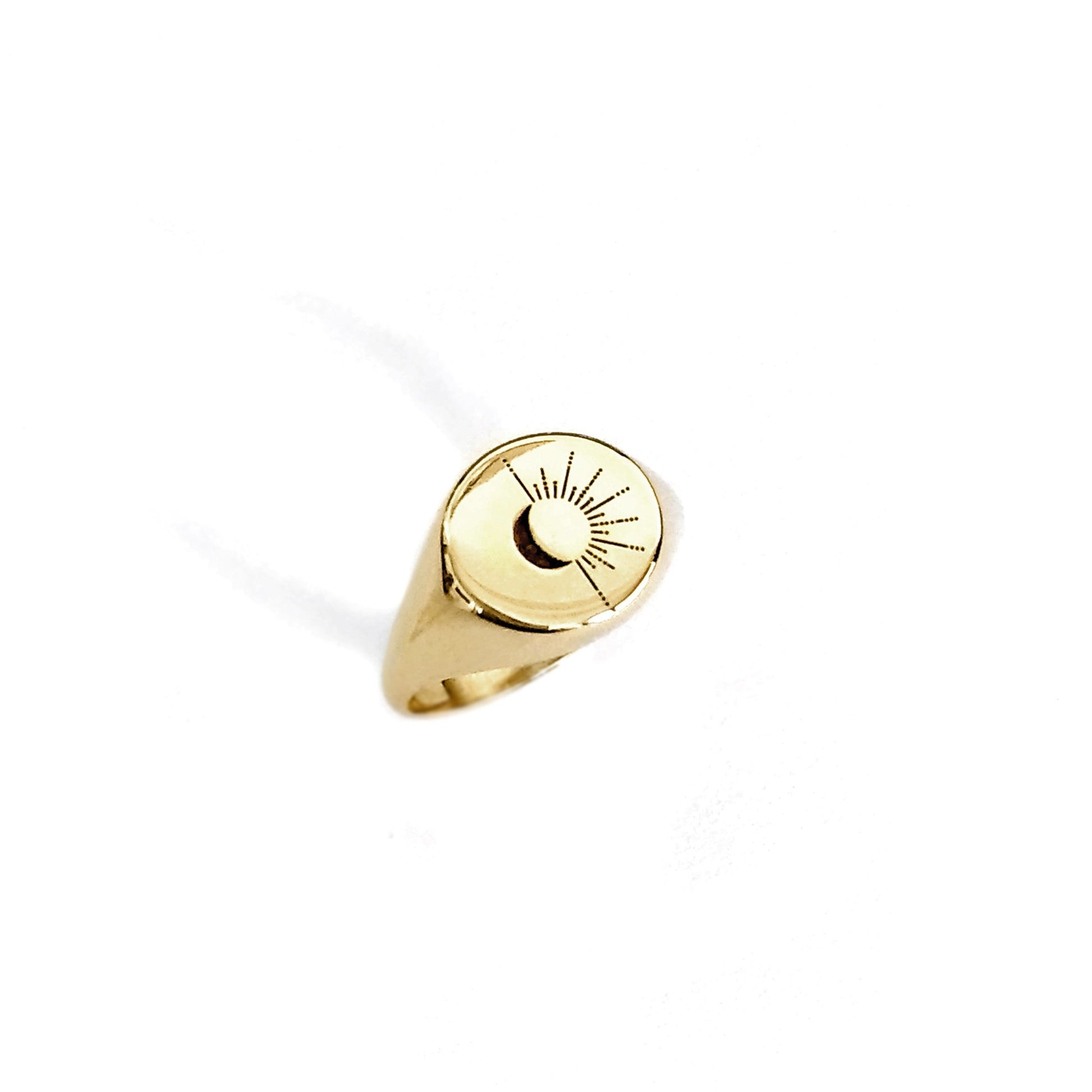 solid yellow gold round signet ring engraved with the sun and moon