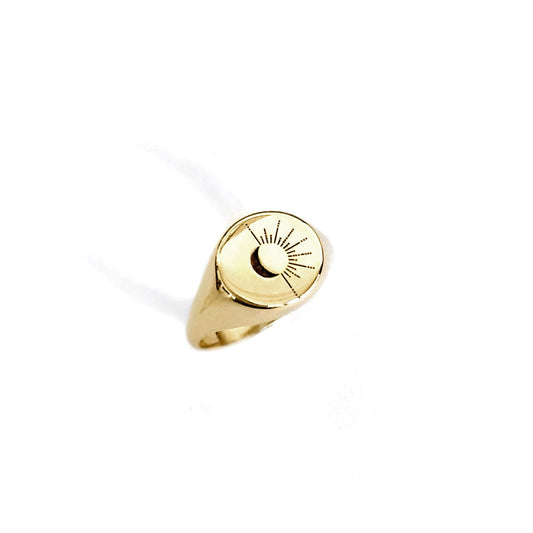 solid yellow gold round signet ring engraved with the sun and moon