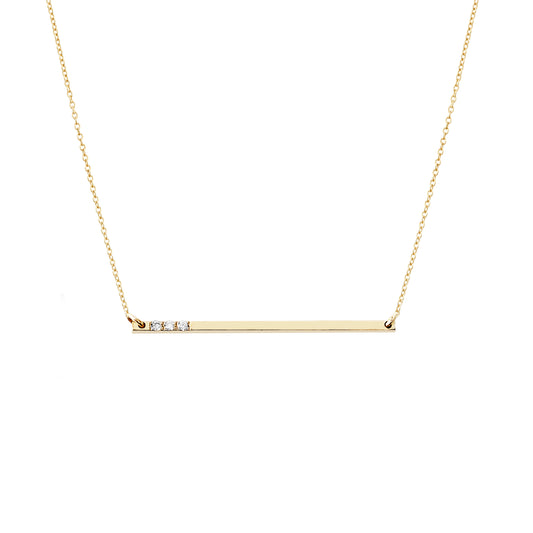 solid yellow gold thin bar necklace set with three tiny white diamonds