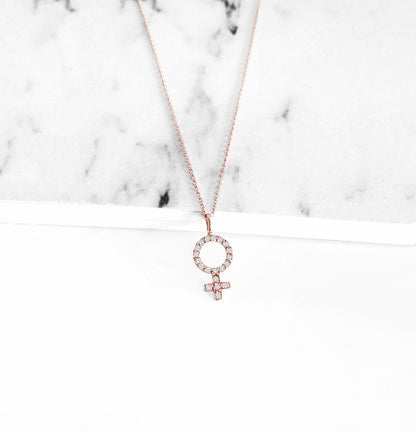 14K rose gold necklace with a female venus symbol charm set with white diamonds