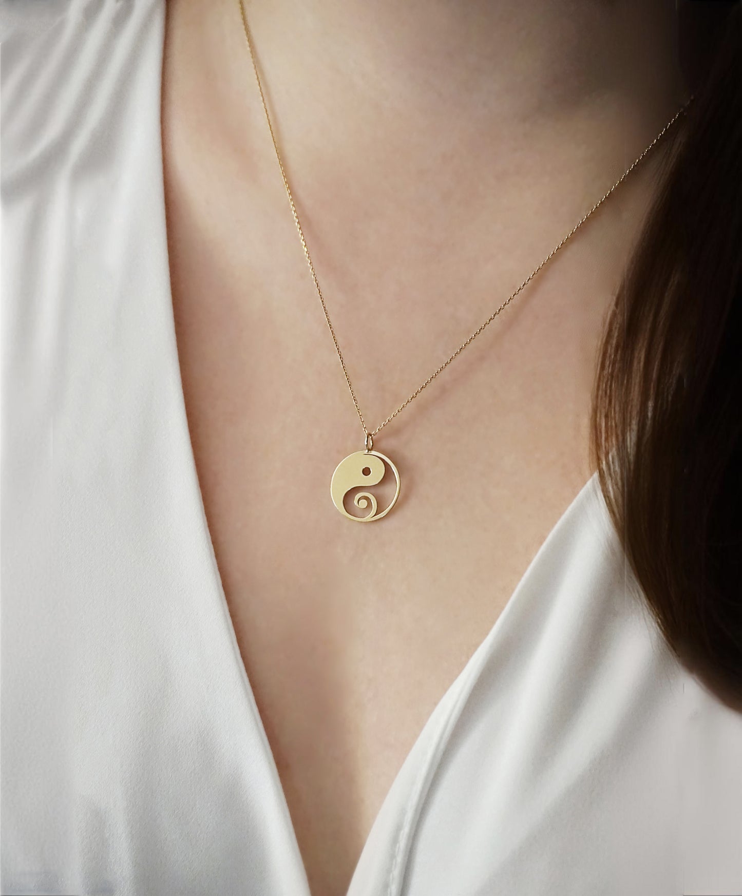 female wearing solid yellow gold necklace with a 16mm yin yang pendant