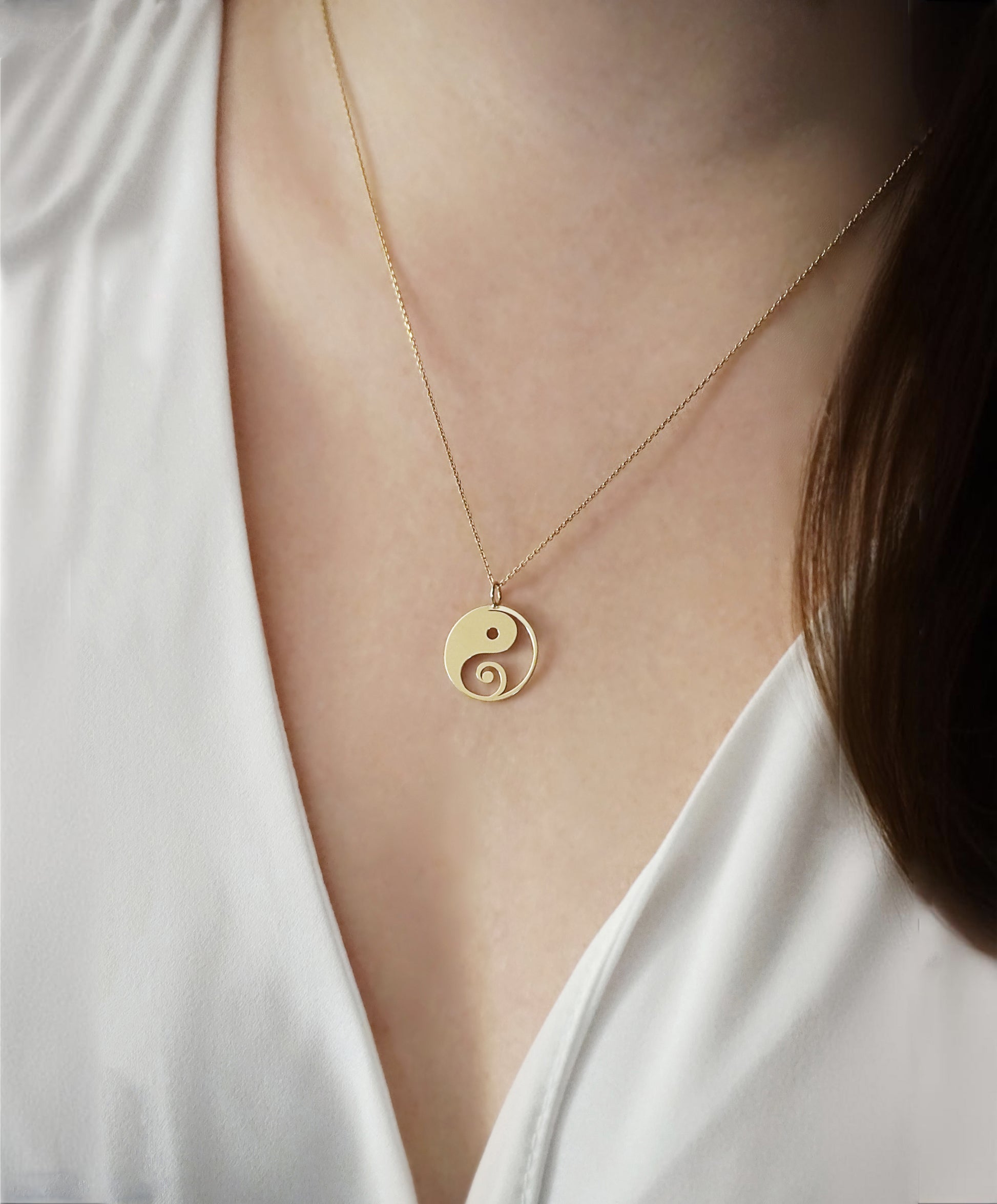 female wearing solid yellow gold necklace with a 16mm yin yang pendant