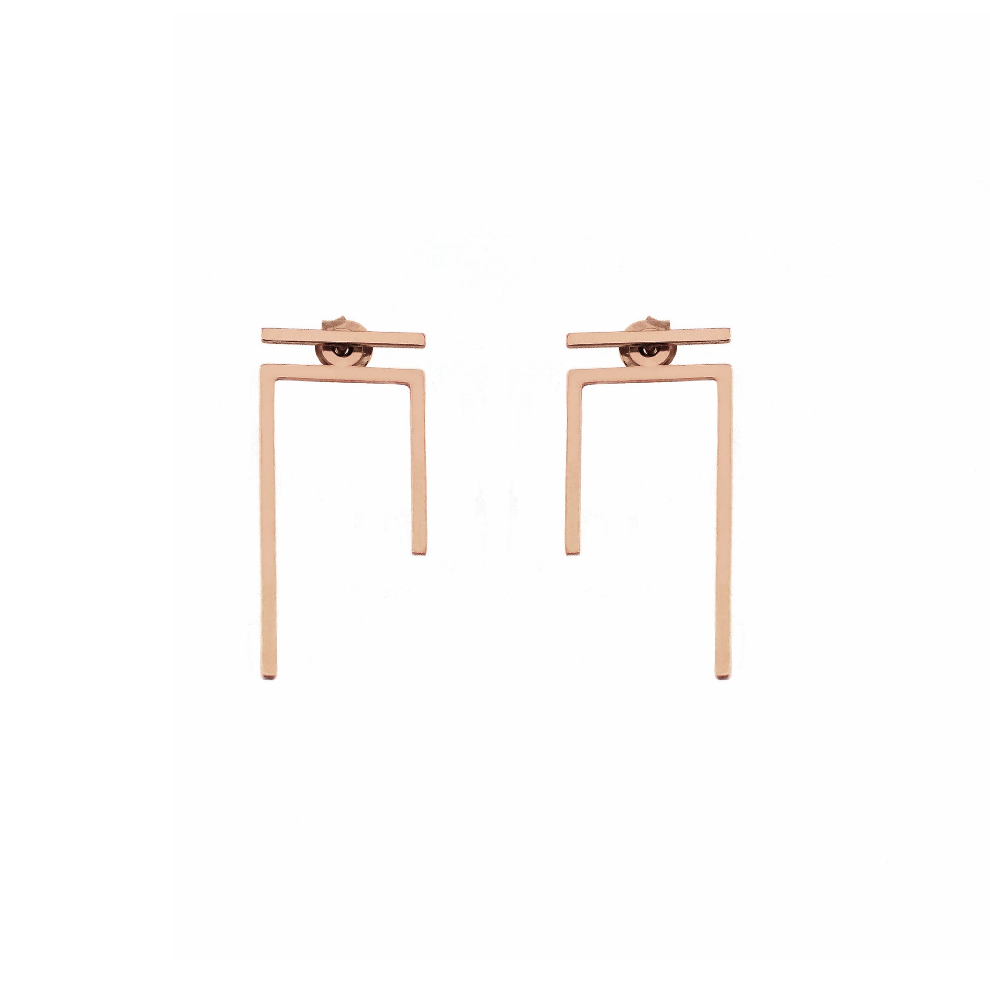 a pair of solid rose gold staple line jacket earring