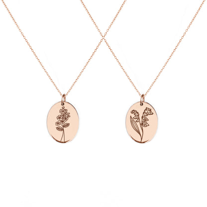two solid rose gold oval pendant necklaces engraved with the birth flowers of May Hawthorn and Lily of the Valley
