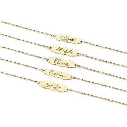 solid yellow gold bracelets with a vintage baroque inspired bar engraved with names in five different fonts