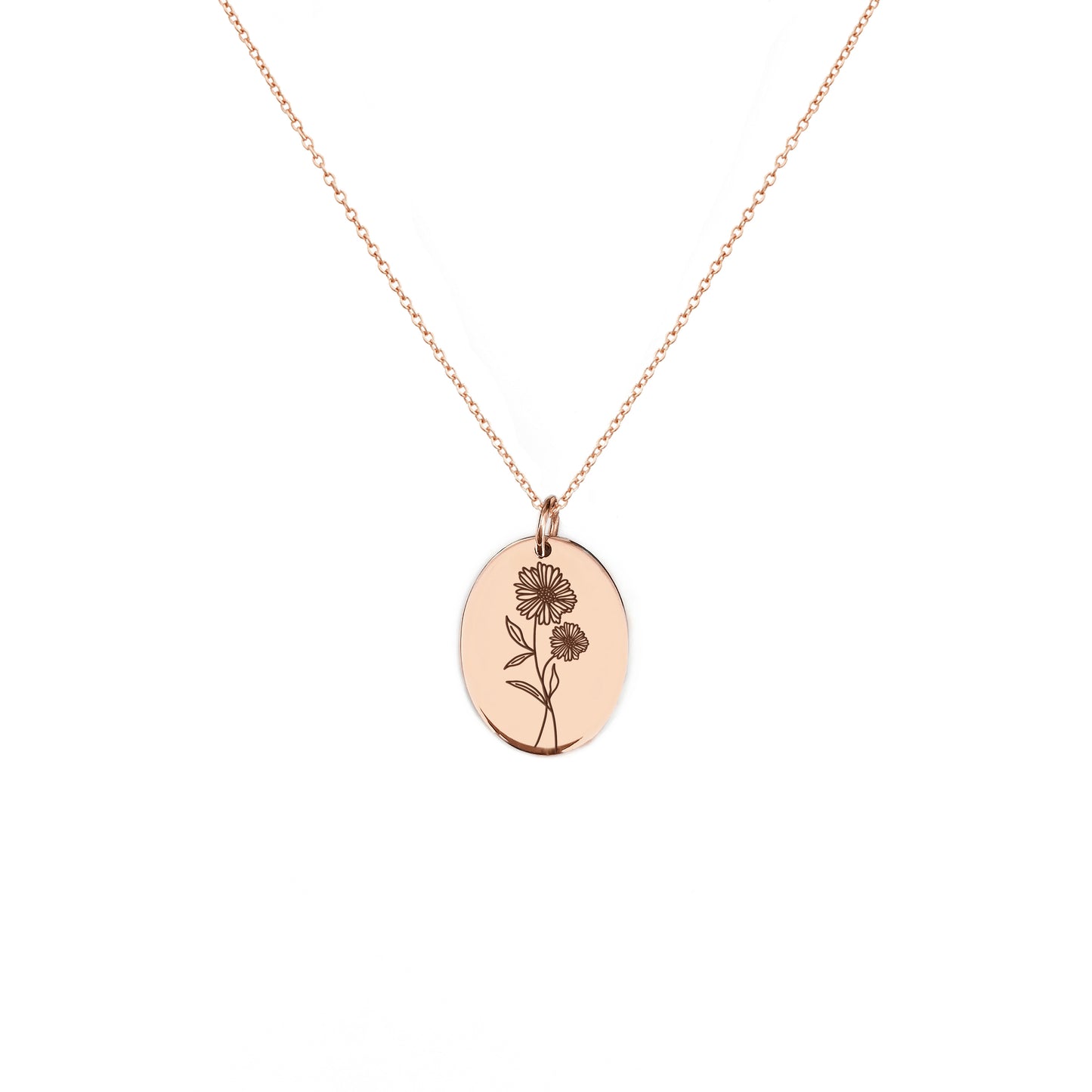 solid rose gold oval pendant necklace engraved with the birth flower of April Daisy