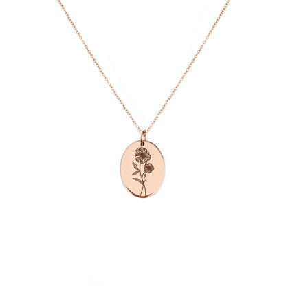 solid rose gold oval pendant necklace engraved with the birth flower of April Daisy