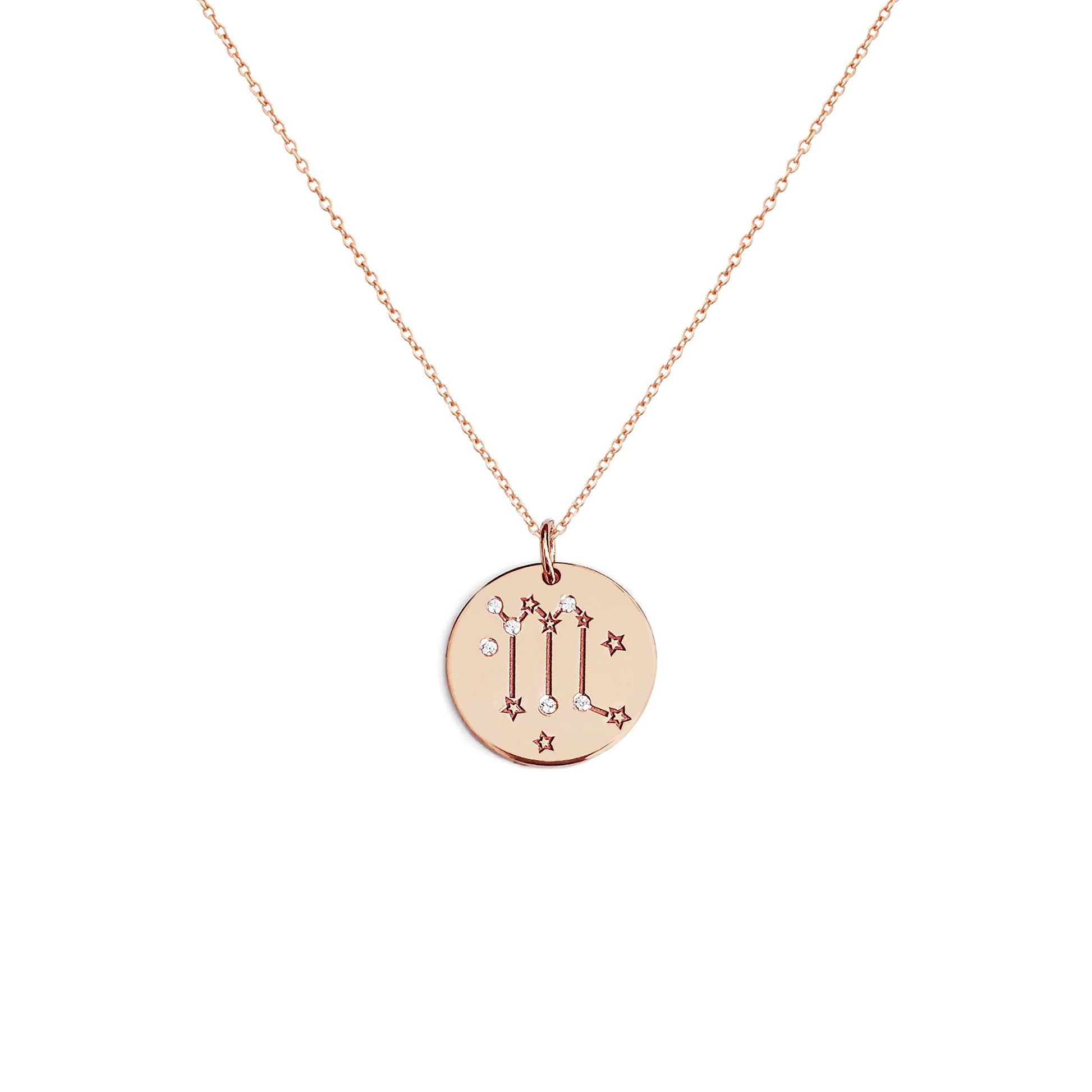 solid rose gold necklace with a 14mm disc pendant engraved with a zodiac sign and set with six tiny diamonds