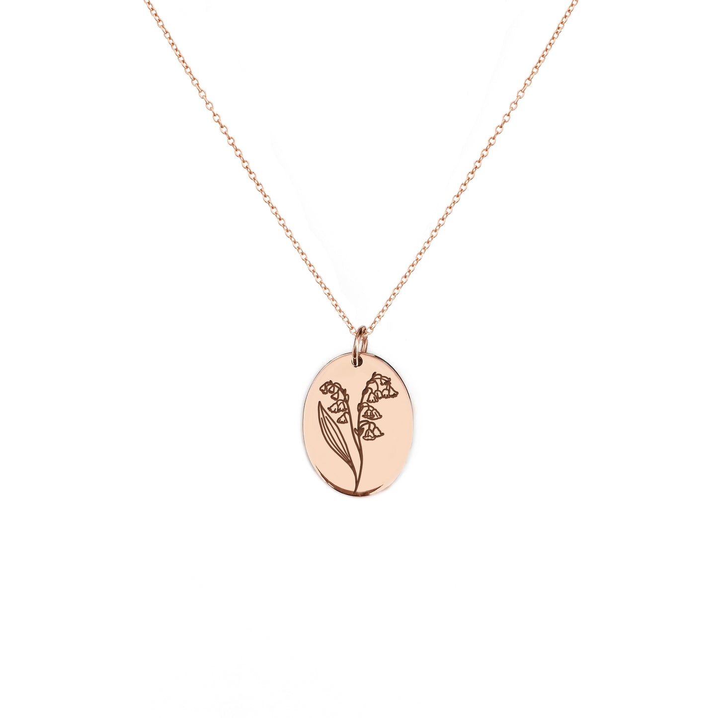 solid rose gold oval pendant necklace engraved with the birth flower of May Lily if the valley
