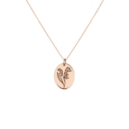 solid rose gold oval pendant necklace engraved with the birth flower of May Lily if the valley