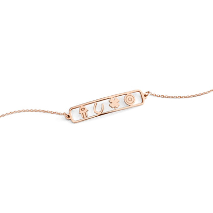 open bar bracelet with four lucky charms, a hamsa, a horseshoe, a clover and an evil eye made in solid rose gold