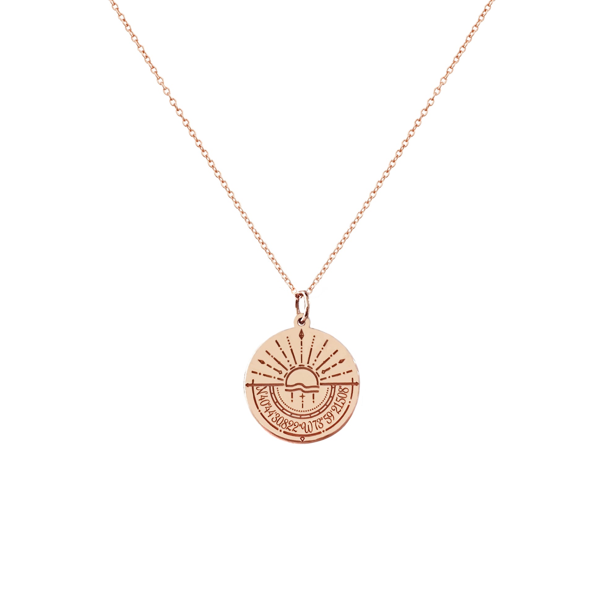 solid rose gold disc pendant necklace engraved with a compass and personalized coordinates