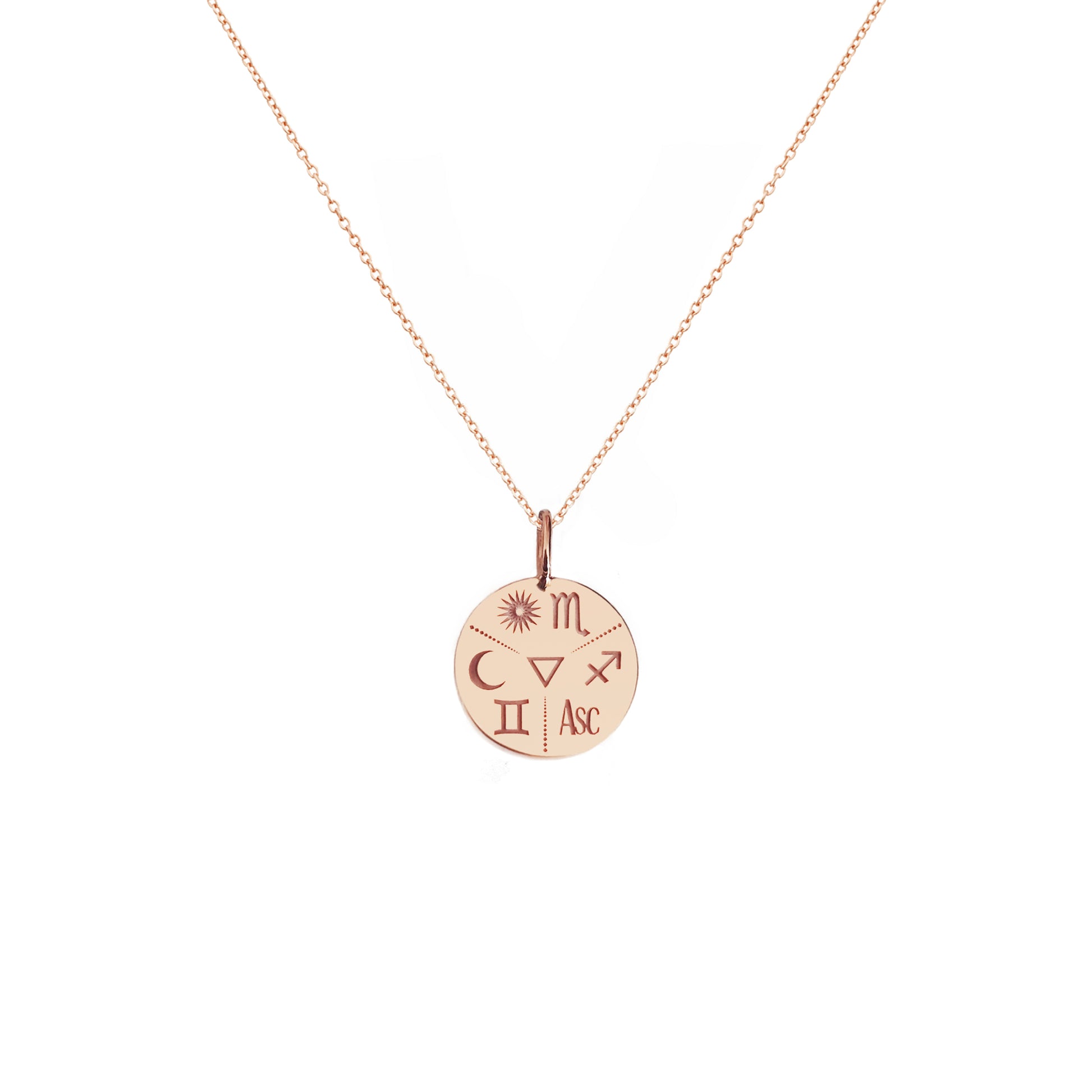 solid rose gold disc pendant necklace personalized with natal chart zodiac signs of the sun the moon and ascendant and an alchemy element in the center