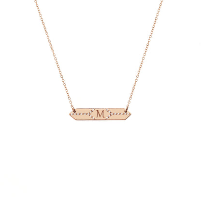 solid rose gold hexagon bar necklace set with white diamonds and engraved with a custom initial/monogram in the center