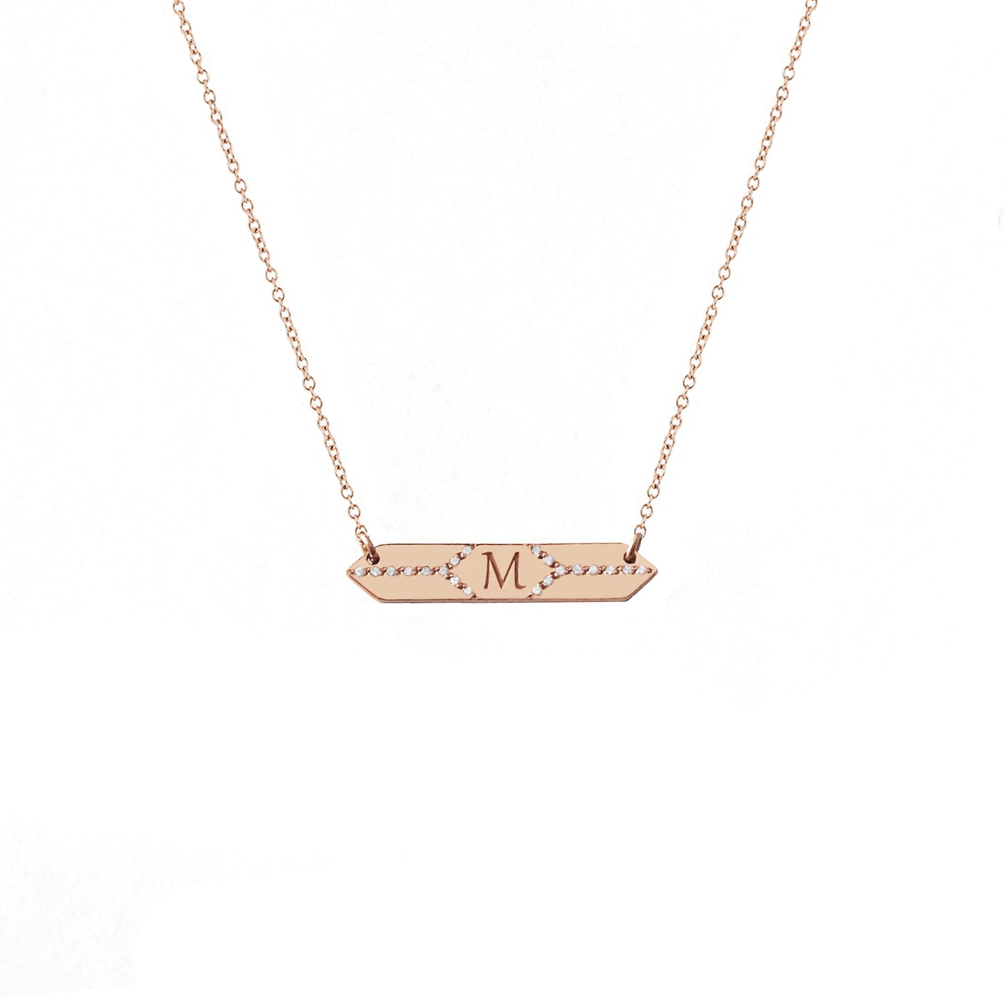 solid rose gold hexagon bar necklace set with white diamonds and engraved with a custom initial/monogram in the center