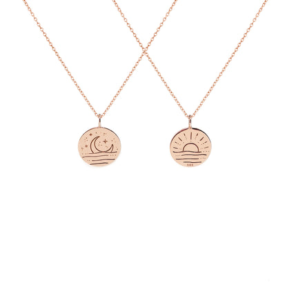 solid rose gold necklace with reversible pendant engraved with a moon on one side and a sun on the other side 
