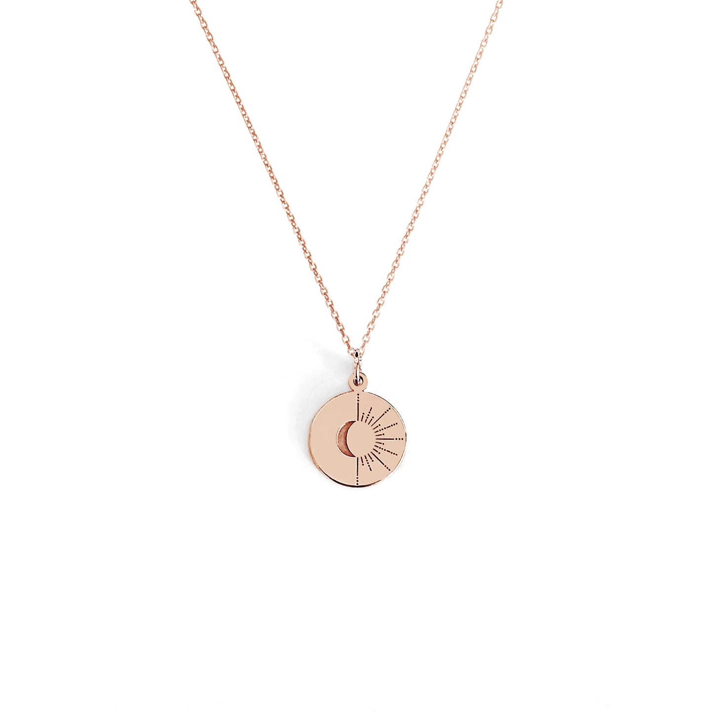 solid rose gold disc pendant necklace engraved with a crescent moon and sun rays