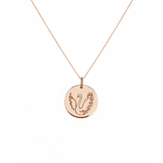 solid rose gold necklace with a 14mm disc pendant engraved with a swan with open wings