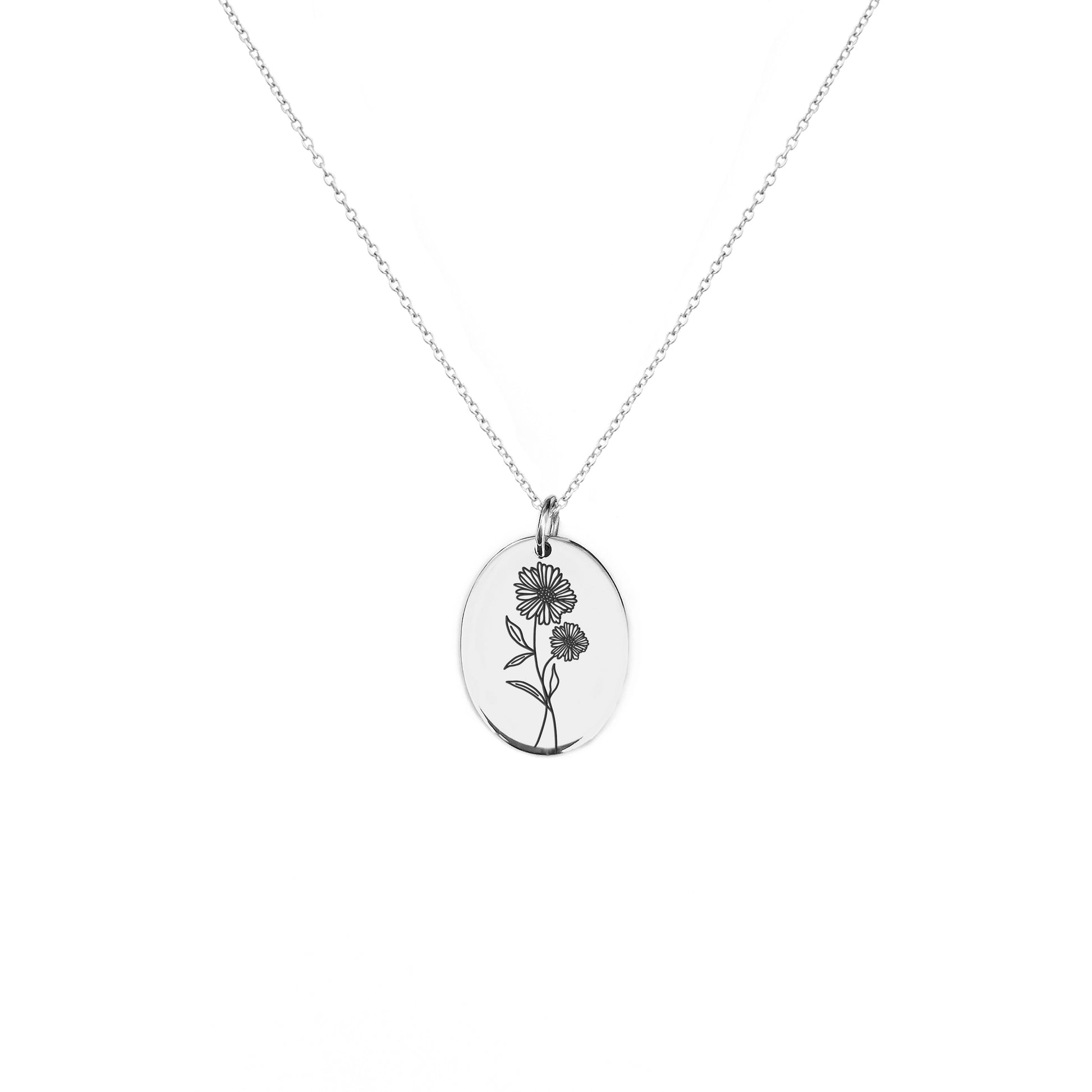 solid white gold oval pendant necklace engraved with the birth flower of April Daisy