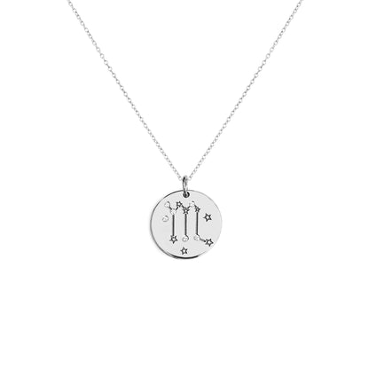 solid white gold necklace with a 14mm disc pendant engraved with a zodiac sign and set with six tiny diamonds