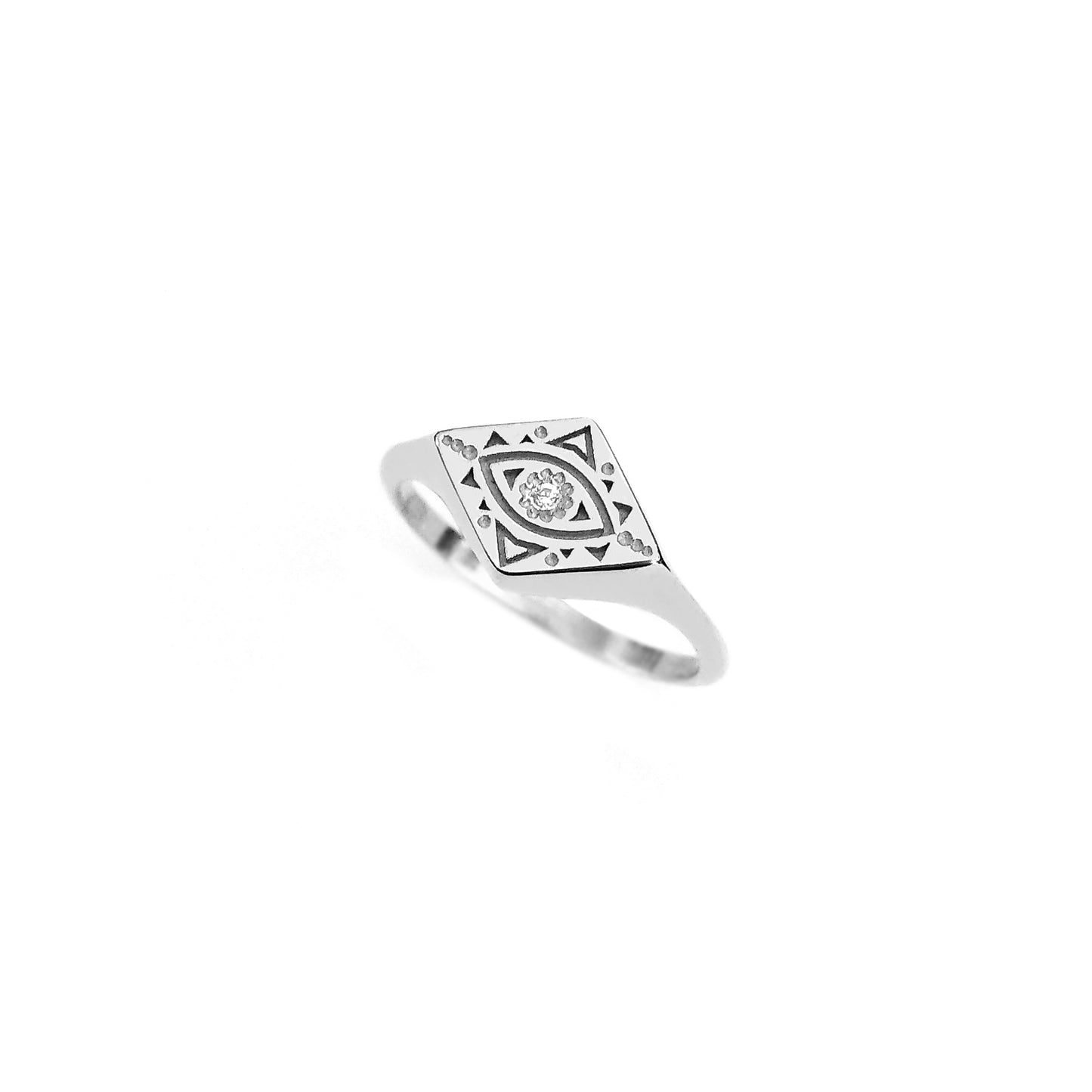 solid white gold rhombus signet ring engraved with a geometric evil eye and set with a tiny white diamond in the center