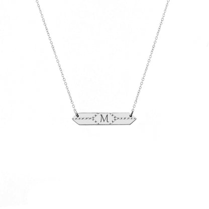 solid white gold hexagon bar necklace set with white diamonds and engraved with a custom initial/monogram in the center
