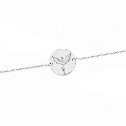 solid white gold bracelet with a 14mm disc charm engraved with a phoenix firebird rising