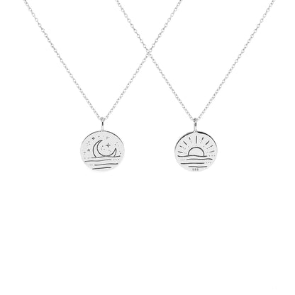 solid white gold necklace with reversible pendant engraved with a moon on one side and a sun on the other side 