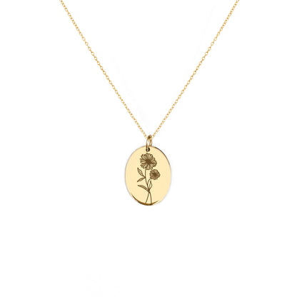 solid yellow gold oval pendant necklace engraved with the birth flower of April Daisy