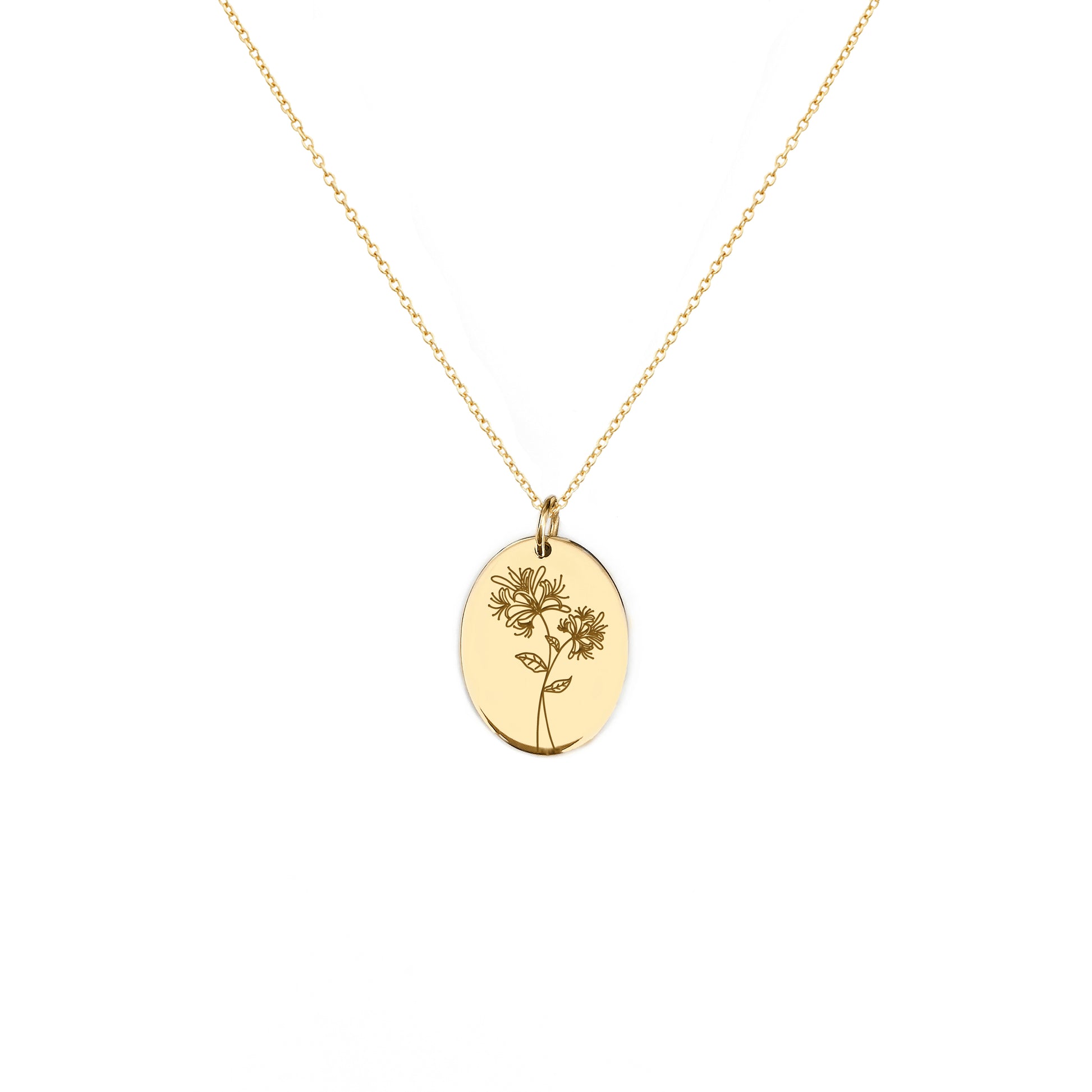solid yellow gold oval pendant necklace engraved with a Honeysuckle the birth flower of June