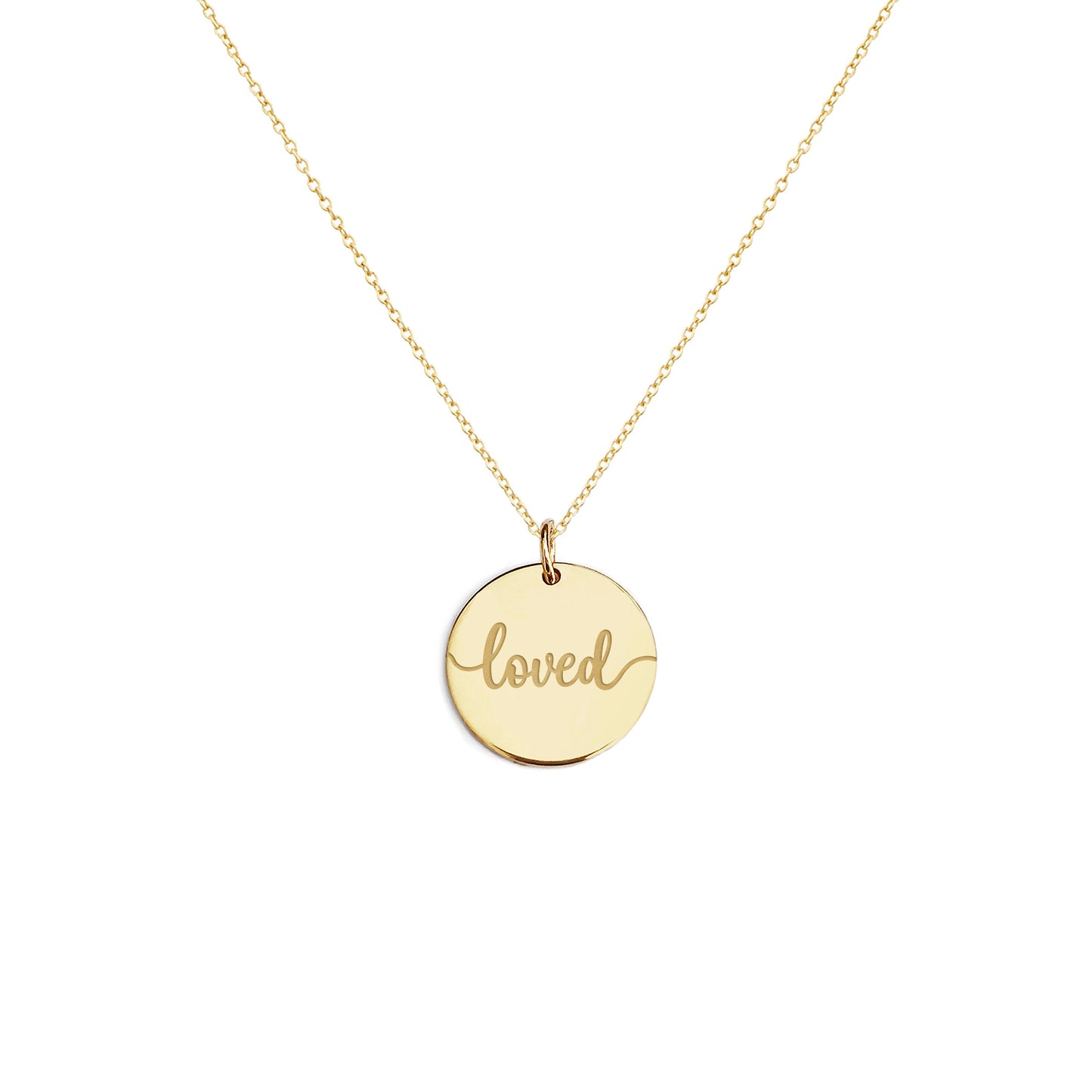 Solid yellow gold necklace with a round pendant engraved with the word 'loved' on a white background